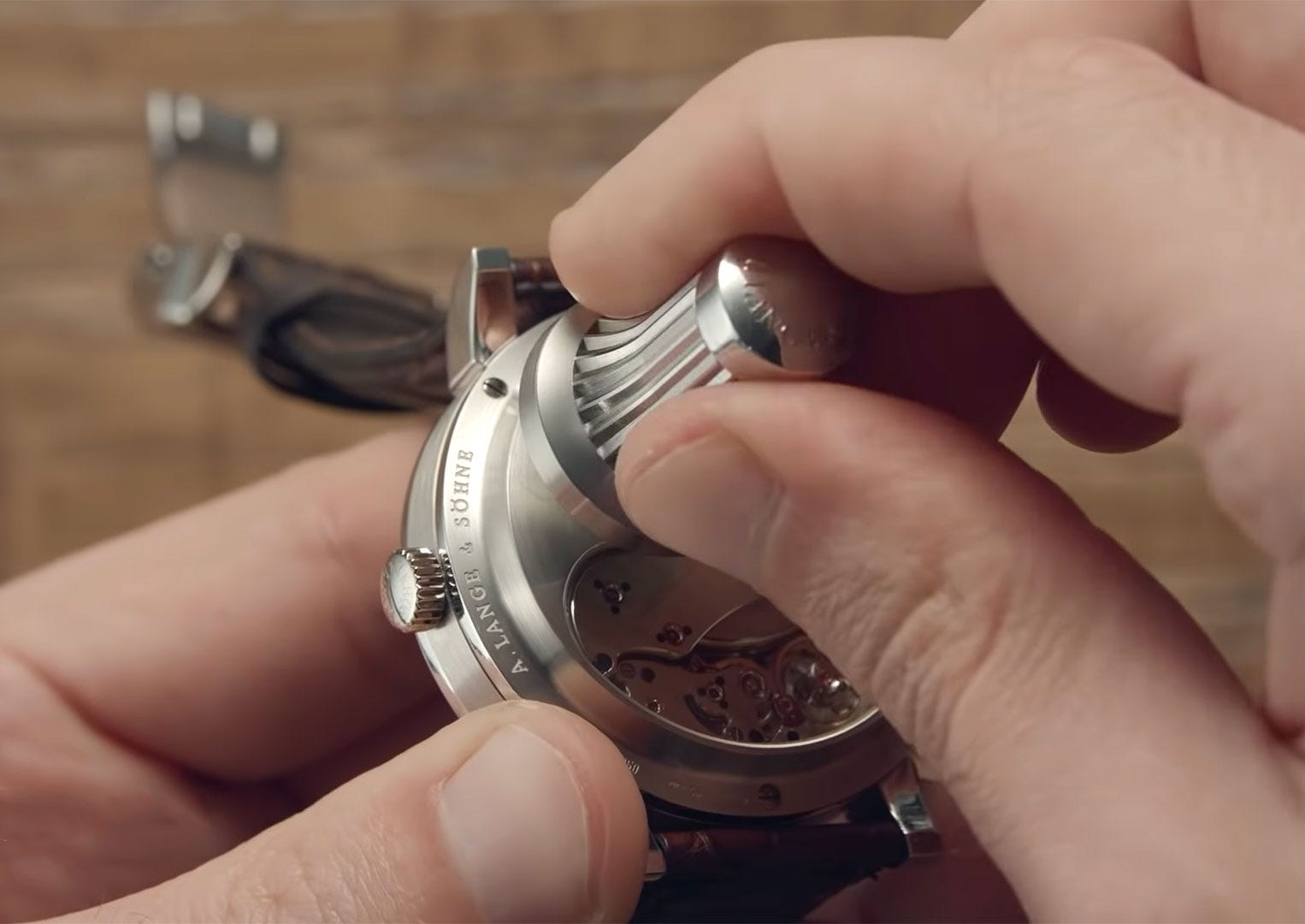Automatic watches have an oscillating weight in them that utilises kinetic energy to feed the movement. Manually wound watches do not have this, therefore, you physically have to wind them when the mainspring runs out of energy