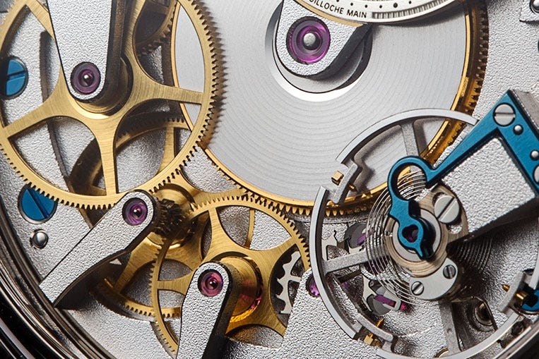 The movement can then be followed from the mainspring through the gear train to the escapement