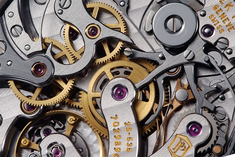 The Patek Philippe has some clever mechanisms that increase performance above the Omega